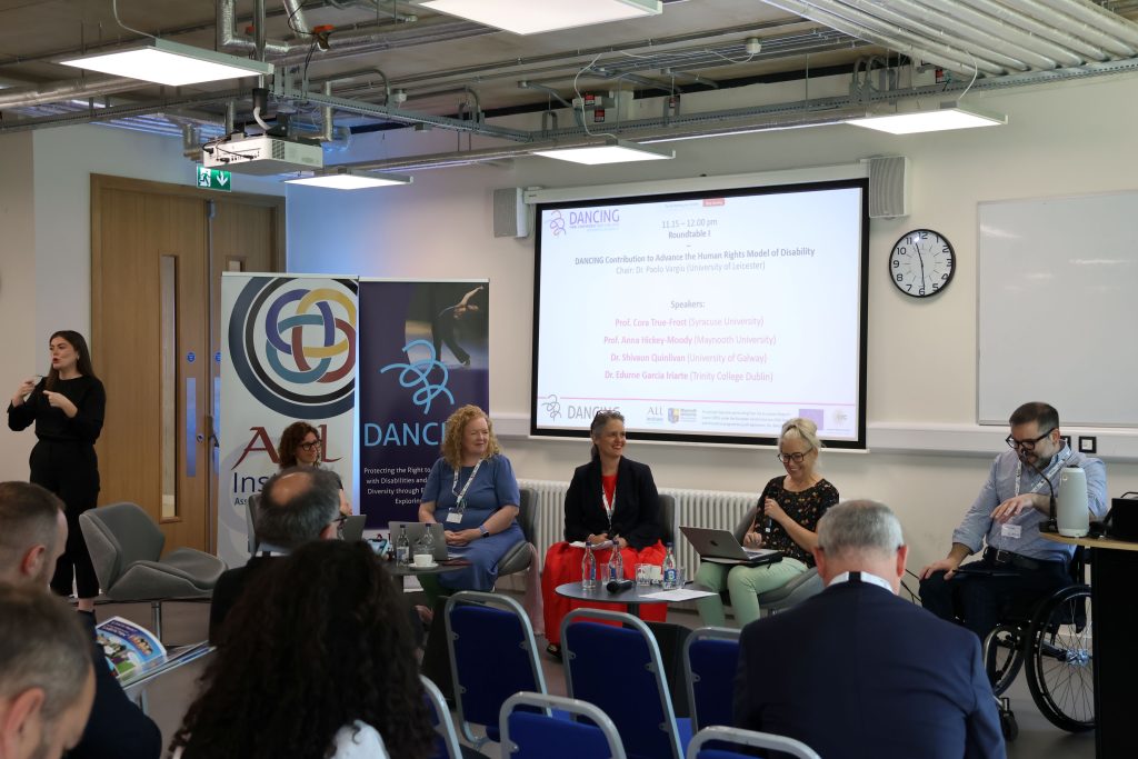 First roundtable of the conference, featuring the chair, and four speakers, Irish Sign Language Interpretation.