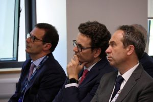 Audience members listening to the presentations of the conference.