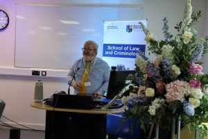 Head of School of Law and Criminology, Prof. Fergus Ryan delivering a speech.