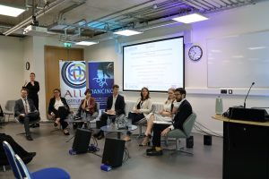 Second roundtable of the conference, featuring the chair, six speakers, and Irish Sign Language interpretation.