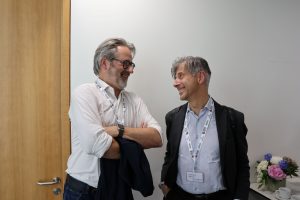 Accessibility Designer Norbert Croonenberg and Prof. Francesco Palermo standing next to and smiling at each others.
